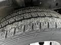 Close-up of a worn tire tread on a 2021 Ford Transit showing distinct grooves and patterns