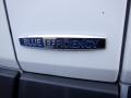 A close-up of a chrome badge on a vehicle displaying the words Blue Efficiency