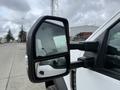 Close-up of the side mirror of a 2021 Ford F600 showcasing its design and reflective surface