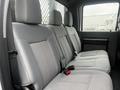 Interior of a 2015 Ford F-550 showing the rear seat with three headrests and a cloth pattern on the seats