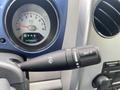 A close-up of a 2007 Chrysler PT Cruiser's control stalk showing the mist setting on the windshield wiper lever