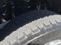 Close-up of a tire from a 2020 Ford F-350 SD showcasing its tread pattern and sidewall details