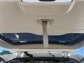 The interior view of a 2013 Ford Expedition showing the underside of the rear hatch with a lifting handle