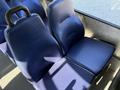Two blue upholstered seats with a smooth surface and contoured backs designed for passenger use in a vehicle