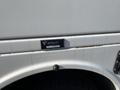 A 2015 Ford F-450 SD truck with a white exterior and a branding plate labeled BrandFX is visible on the side