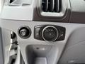 Close-up of control knobs on the dashboard of a 2017 Ford Transit including headlight settings and vent controls