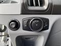 Dashboard controls of a 2017 Ford Transit featuring a headlight adjustment knob and various settings for vehicle lighting