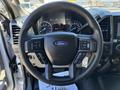 Steering wheel of a 2020 Ford F-350 SD featuring controls for audio and cruise settings