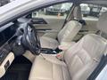 Interior view of a 2017 Honda Accord Hybrid showcasing two front seats a steering wheel and controls on the dashboard