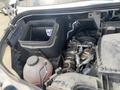 A 2025 Mercedes-Benz Sprinter engine compartment showing the engine and various components including an air filter and a fluid reservoir