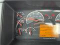 Dashboard of a 2012 Volvo VNL displaying various gauges including speedometer and engine metrics with an orange data screen showing engine hours and total distance driven