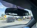 Interior view of a 2007 Chrysler PT Cruiser with a rearview mirror reflecting the vehicle's interior and other cars in the background