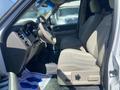 Interior view of a 2013 Ford Expedition showing the driver's seat steering wheel and dashboard with beige upholstery