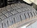 Close-up of a tire from a 2019 Ford Econoline showing detailed tread patterns and wear on the rubber surface