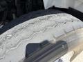 Close-up of a worn tire on a 2009 International 7500 showing visible cracks and tread wear