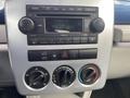 Dashboard of a 2007 Chrysler PT Cruiser featuring radio controls and climate controls with knobs for temperature and airflow