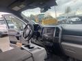 Interior view of a 2017 Ford F-550 showing the dashboard steering wheel and center console