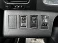 Control panel of a 2020 Hino 338 featuring buttons for setting and resuming functions and a knob for light control