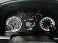 Dashboard of a 2022 RAM 1500 Classic displaying speedometer fuel gauge and digital screen with trip statistics and Apple CarPlay information