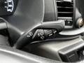 Close-up of the control stalk for headlights and windshield wipers inside a 2021 Ford Transit vehicle