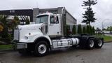 2019 Western Star Trucks 4900 with a white cab and black chassis parked with a straight configuration