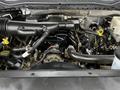 A close-up view of the engine compartment of a 2017 Ford F-550 featuring various hoses wires and engine components