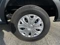 A close-up of the wheel and tire of a 2017 Ford Transit featuring a silver five-spoke rim and a black tire with the brand name ContiVan on the sidewall