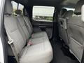 A 2017 Ford F-150 with a spacious rear seat featuring gray fabric upholstery and three seatbelts