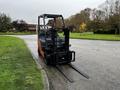 A 2017 Toyota 8FCGCU25 forklift parked on a paved surface with its forks raised