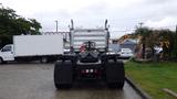 A 2019 Western Star Trucks 4900 with a distinctive grille and large rear tires is parked facing forward