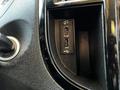 A close-up view of the center console of a 2022 Mercedes-Benz Metris featuring two USB ports and a circular gear shift knob