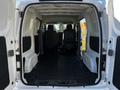 Interior view of a 2017 Nissan NV200 showcasing the spacious cargo area with two front seats visible in the background