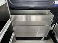 A metal storage unit with two stacked drawers designed for efficient organization inside a vehicle