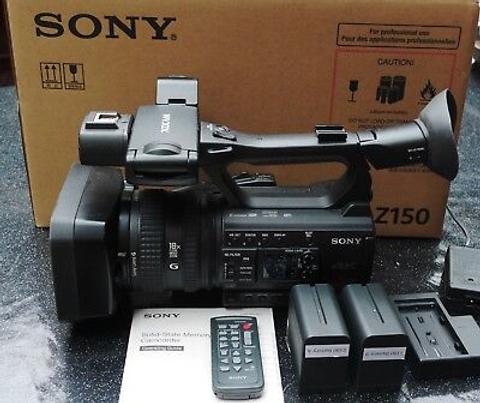 A Sony camcorder with multiple lenses and accessories including batteries and a remote control