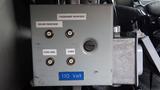 Control panel for a 2012 International 7400 featuring labeled buttons for driver and passenger sides a cord reel and a cabin with a voltage indicator