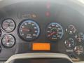 Dashboard of a 2016 International 7400 featuring gauges for RPM water oil volts fuel and a digital display showing mileage and warning indicators