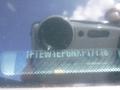 2022 Ford F-150 visible through a reflective surface with a clear view of the vehicle identification number displayed