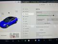 A 2019 Tesla Model 3 displayed on a car control screen with charging details and options for opening the trunk and charge port