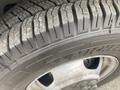 Close-up of a tire on a 2018 Chevrolet Express showing tread patterns and sidewall details