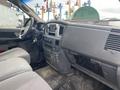 Interior view of a 2008 Dodge Ram 5500 showing the dashboard seats and steering wheel with controls and keys visible