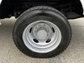 A 2016 Ford F-550 truck wheel showing a silver rim with six lug nuts and a rugged tire tread pattern