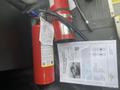 A 2018 Chevrolet Express vehicle fire extinguisher and a printed document with vehicle information and safety instructions