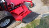 A red 2014 Ferris Mower ISX 800 with a visible cutting deck and large rear tires designed for commercial lawn care