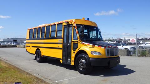 2014 Freightliner Thomas Diesel school bus with a bright yellow exterior and red safety stripes on the front and sides