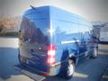 A blue 2017 Mercedes-Benz Sprinter van showing the rear and side view with a sleek design and large cargo area