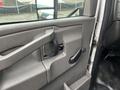 Interior door panel of a 2017 Chevrolet Express featuring a door handle and control lever