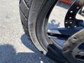 Close-up of a 2021 Harley-Davidson RA1250 S motorcycle tire showing tread pattern and tire specifications