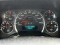 The dashboard of a 2017 Chevrolet Express displaying the speedometer fuel gauge and engine hour meter