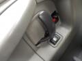 Close-up of the door handle and window control button of a 2011 Chevrolet Express showcasing the interior features
