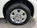 Close-up of a silver alloy wheel with a multi-spoke design mounted on a black tire featuring the GoodYear branding